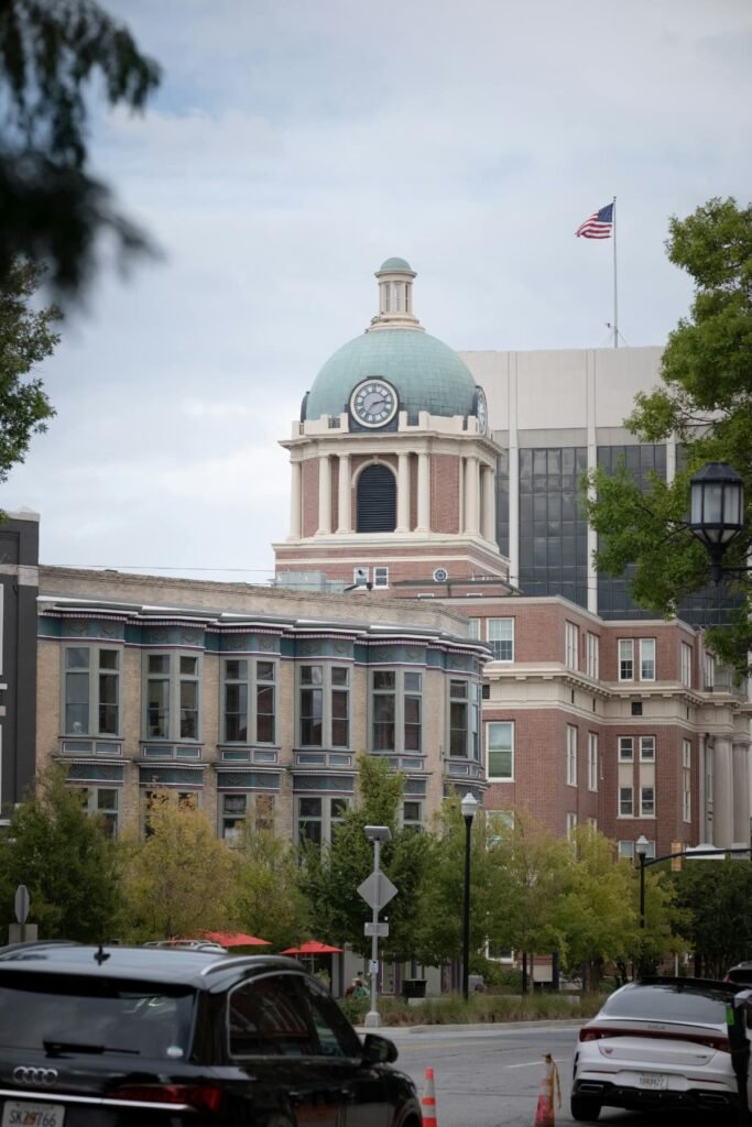 Downtown Macon cityscape featuring historic architecture and the iconic courthouse dome, representing the local communities Dinosaur Roofing & Repair proudly serves with trusted residential and commercial roofing services across Middle Georgia