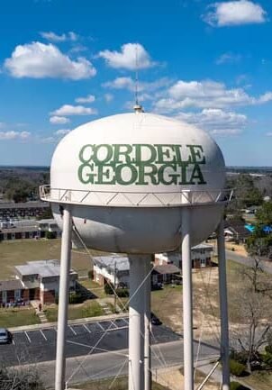 Cordele, Georgia water tower landmark representing the local community Dinosaur Roofing & Repair proudly serves with trusted residential and light commercial roofing services across Middle Georgia